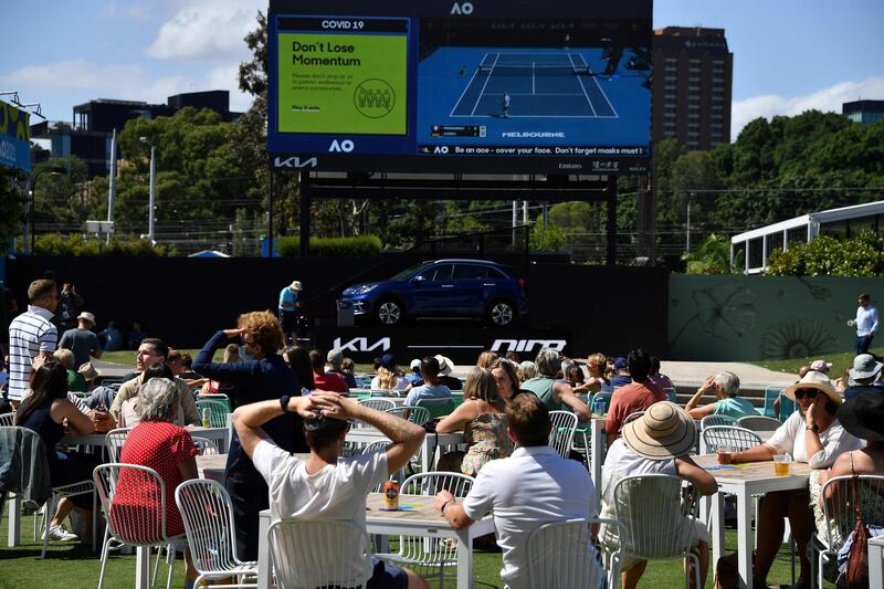 Fans watch a match on day five of the Australian Open at Melbourne Park. AFP