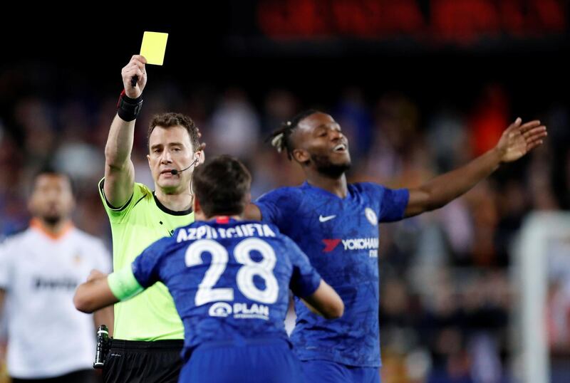 Chelsea's Cesar Azpilicueta is shown a yellow card by referee Felix Zwayer. Reuters