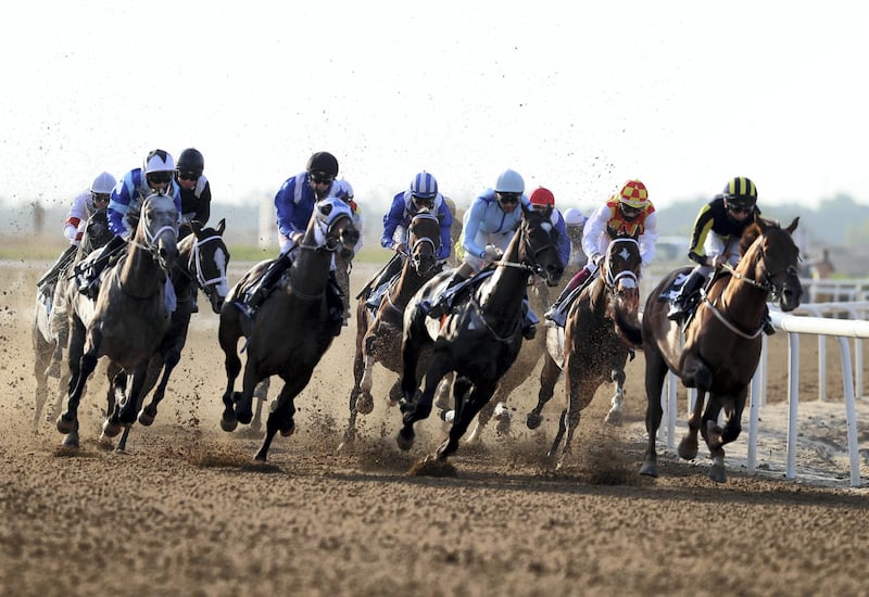 Sharjah, United Arab Emirates - November 28, 2020: Winner of the fifth race Galvanize ridden by Nathan Crosse (red and yellow), in the Sheikh Hamdan bin Rashid Al Maktoum Cup for thoroughbreds. Saturday, November 28th, 2020 in Sharjah. Chris Whiteoak / The National