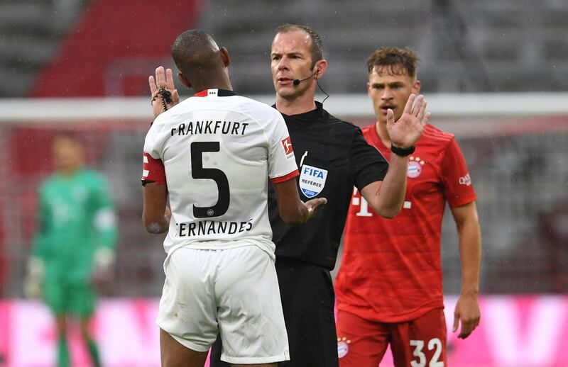 Frankfurt midfielder Gelson Fernandes debates with referee Marco Fritz. AFP