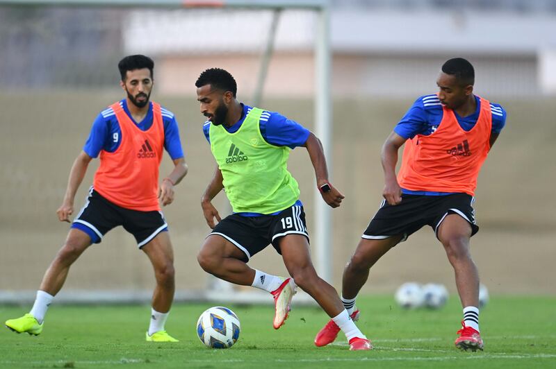 Tahnoun Al Zaabi, centre, Ali Salmeen, right, and Bandar Al Ahbabi during a UAE training session.