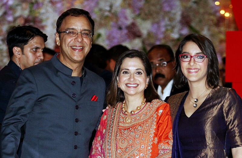 Indian Bollywood film director, screenwriter and producer Vidhu Vinod Chopra (L) poses for a picture with wife Anupama Chopra and daughter Zuni. AFP