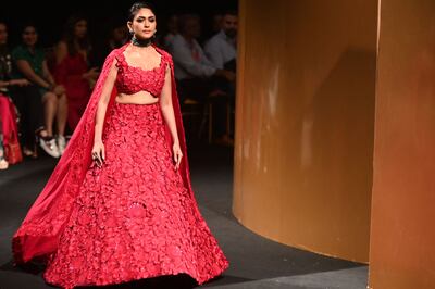 Bollywood actress Mrunal Thakur presents a creation by designer Mishru at Lakme Fashion Week. AFP