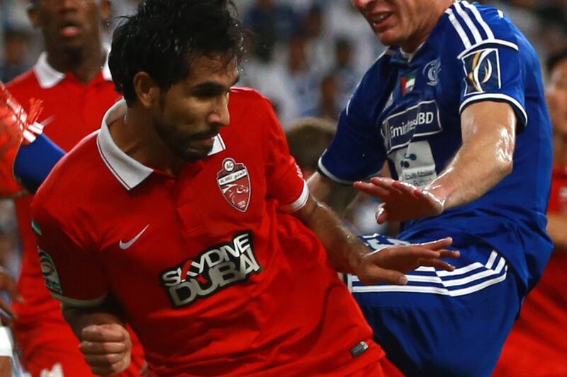 Habib Fardan of Al Ahli competes against Al Nasr in the President's Cup final last year. AFP Photo / STR / June 3, 2015