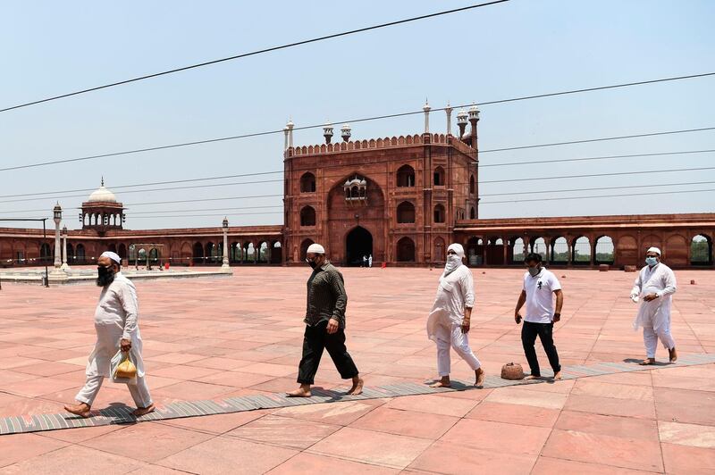 Worshippers arrive for prayers at the Jamma Masjid in New Delhi. AFP