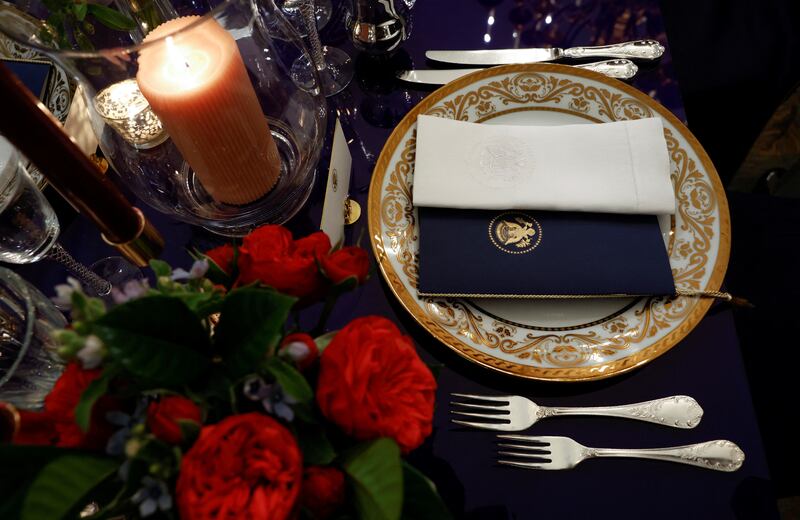 An example of the table setting and floral arrangement for Thursday evening's State Dinner. EPA
