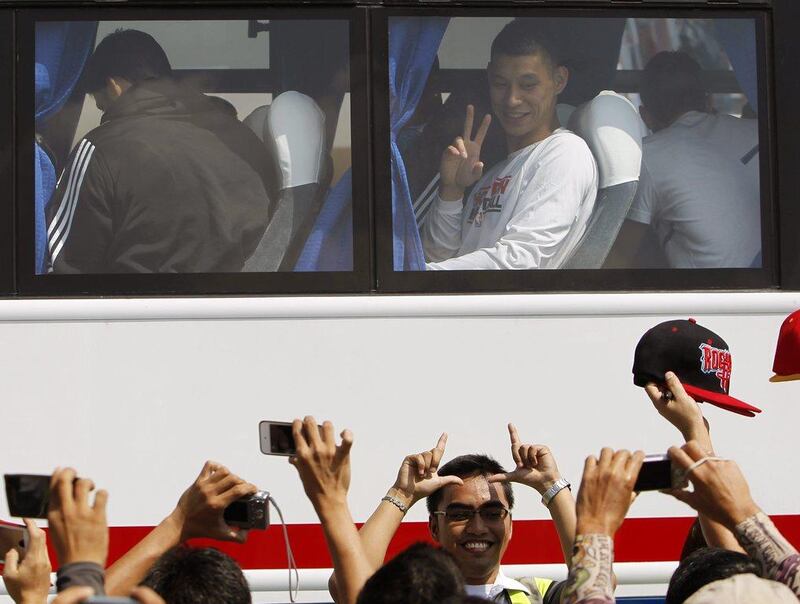 Jeremy Lin and the Houston Rockets arrived in Manila on Monday to a throng of Filipino basketball fans. Jay Directo / AFP