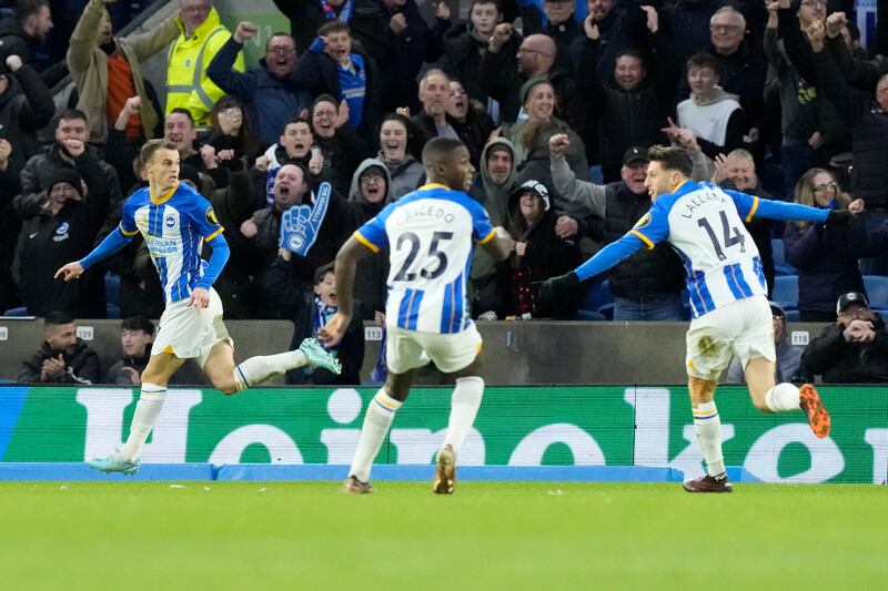 Solly March, left, celebrates after scoring his side's first. AP