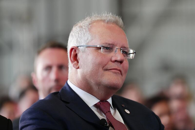 SYDNEY, AUSTRALIA - NOVEMBER 15: Australian Prime Minister Scott Morrison looks on during the Qantas celebration of the arrival of London To Sydney direct flight and centenary event on November 15, 2019 in Sydney, Australia. The centenary celebrations marks Qantas entering its 100th year of service, along with the arrival of Project Sunrise research flight QF7879 direct from London into Sydney. It is only the second time in 30 years that this route has been flown directly. (Photo by Mark Metcalfe/Getty Images)