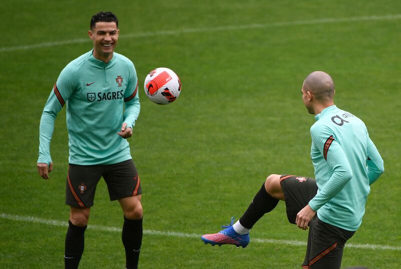 Cristiano Ronaldo works with defender Pepe at a Portugal training session at the Dragao Stadium in Porto on Monday, March 28, 2022, ahead of the World Cup 2022 qualifying final against North Macedonia. AFP