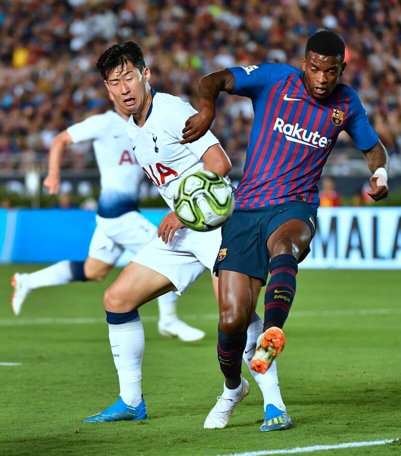 Nelson Semedo of Barcelona clears the ball under pressure from Son Heung-min of Tottenham Hotspur. AFP
