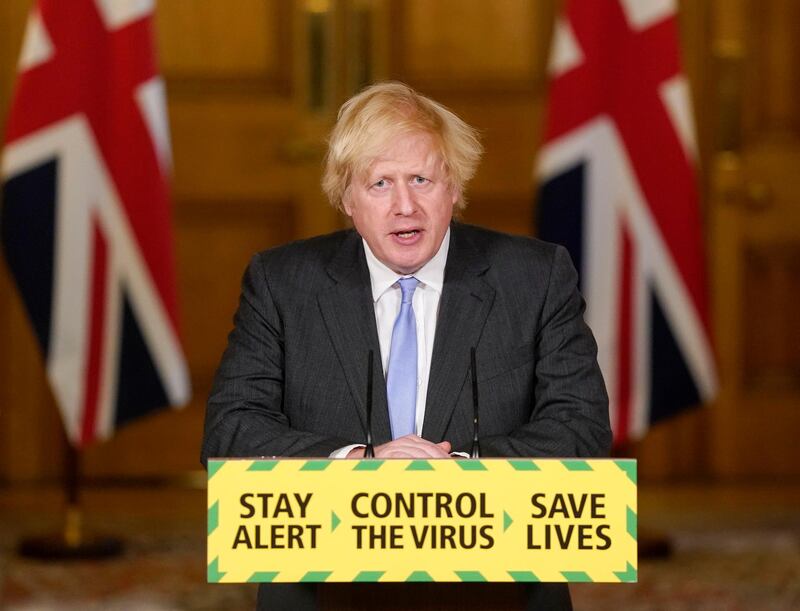 In this handout photo provided 10 Downing Street, Britain's Prime Minister Boris Johnson speaks during a media briefing on coronavirus in Downing Street, London, Tuesday, June 23, 2020. Johnson says people in England will be able to go to the pub, visit a movie theater, get a haircut or attend a religious service starting July 4. The major loosening of coronavirus lockdown restrictions Johnson announced Tuesday will help thaw a British economy that has been in deep freeze for three month. (Andrew Parsons/10 Downing Street via AP)