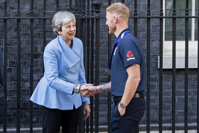 British prime minister Theresa May shakes hands with England all-rounder Ben Stokes. AFP