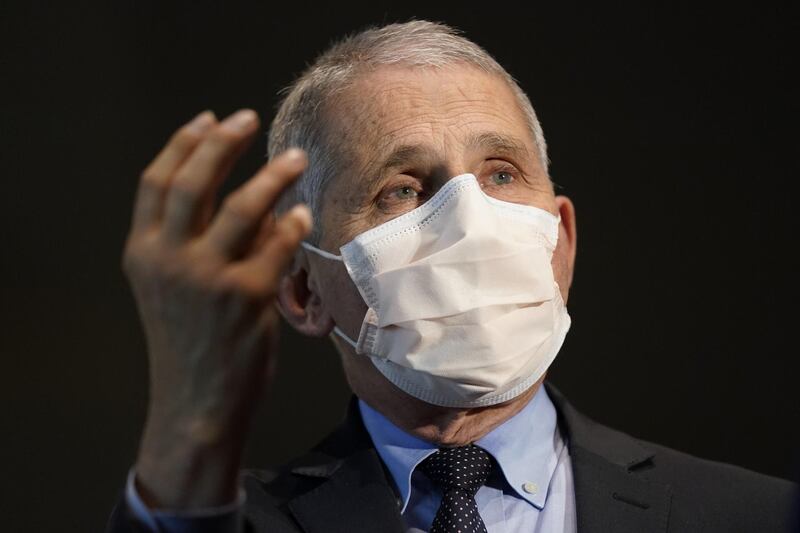 Anthony Fauci, director of the National Institute of Allergy and Infectious Diseases, speaks with Alex Azar, secretary of Health and Human Services (HHS), not pictured, before they receive the Moderna Inc. Covid-19 vaccine during an event at the NIH Clinical Center Masur Auditorium in Bethesda, Maryland, U.S., on Tuesday, Dec, 22, 2020. The National Institutes of Health is holding a livestreamed vaccination event to kick-off the organization's efforts for its employees on the front line of the pandemic. Photographer: Patrick Semansky/Associated Press/Bloomberg