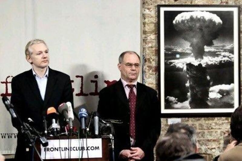 Julian Assange, left,and Rudolf Elmer.