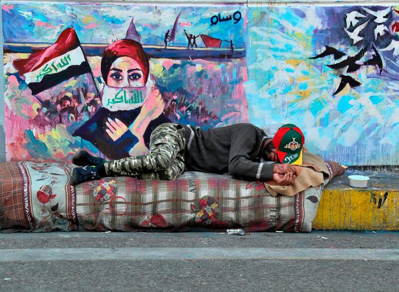 A protester rests during a sit-in at Tahrir Square. AP Photo