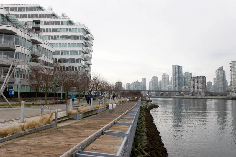 The bay surrounding the Vancouver Olympic Village is seen on January 21, 2014. Four years after the winter olympic were organized in Vancouver, this Canadian city is still struggling to evaluate how much it cost the taxpayers to build the Olympic Village. Altough the initial plans were to build a sustainable, green and social neigborhood, with at least 20 percent social housing (compare to less that 10 percent today), bad management and the financial crisis forced Vancouver city to invest 1 billion dollars one year before the games, and to give up it's social commitment. PHOTO CLEMENT SABOURIN (Photo by Clement Sabourin / AFP)