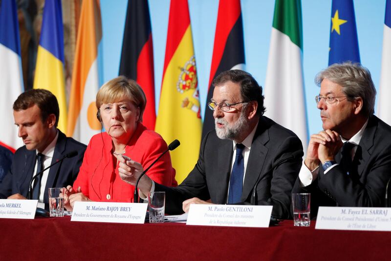 From L-R: French President Emmanuel Macron, German Chancellor Angela Merkel, Spain's Prime Minister Mariano Rajoy and Italian Prime Minister Paolo Gentiloni attend a news conference following talks on European Union integration, defence and migration at the Elysee Palace in Paris, France August 28, 2017. REUTERS/Charles Platiau