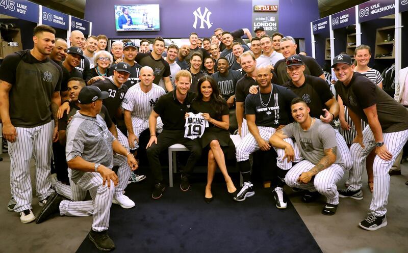 LONDON, ENGLAND - JUNE 29: In this handout image provided by The Invictus Games Foundation, Prince Harry, Duke of Sussex and Meghan, Duchess of Sussex join the New York Yankees in their Clubhouse and receive gifts for Archie ahead of their match against the Boston Red Sox at the London Stadium  in London, England. The historic two-game "You Just Cant Beat The Person Who Never Gives Up" series marks the sports first games ever played in Europe and The Invictus Games Foundation has been selected as the official charity of Mitel and MLB London Series 2019. Getty Images