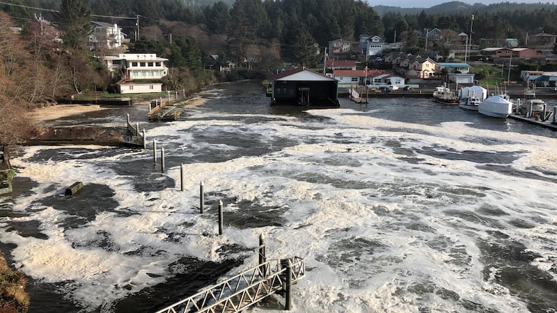 An extreme high tide rolls in and floods parts of the harbor in Depoe Bay, Oregon. AP Photo/Gillian Flaccus