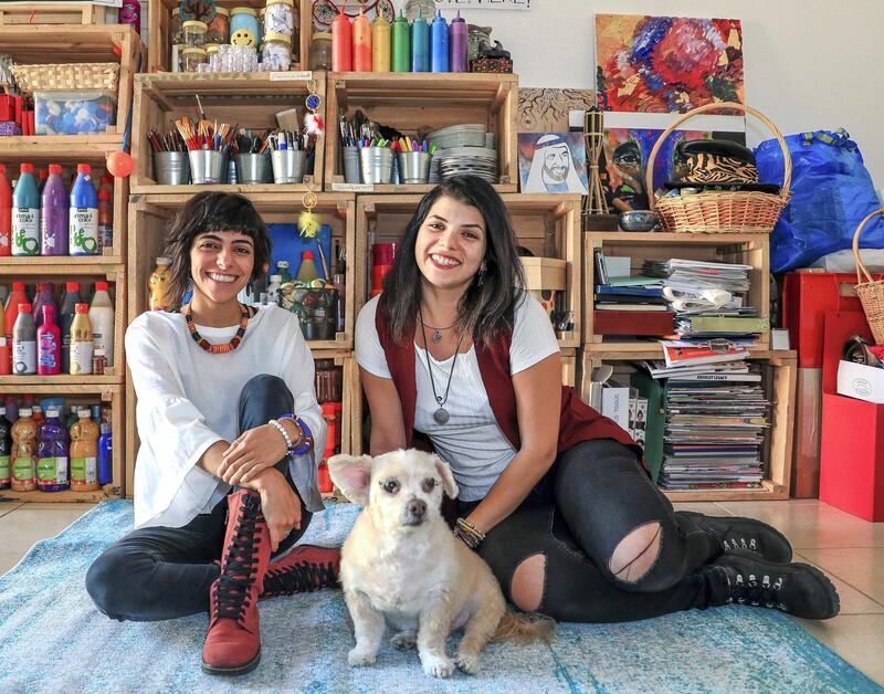 Abu Dhabi, U.A.E., February 2, 2019.   Christina (right) and Tanya Awad with their dog Brownie, have brought together hundreds of people since they launched their indie arts and culture initiative, Blank Canvas Community. 
Victor Besa/The National
Section:  WK
Reporter:  Nathalie Farah