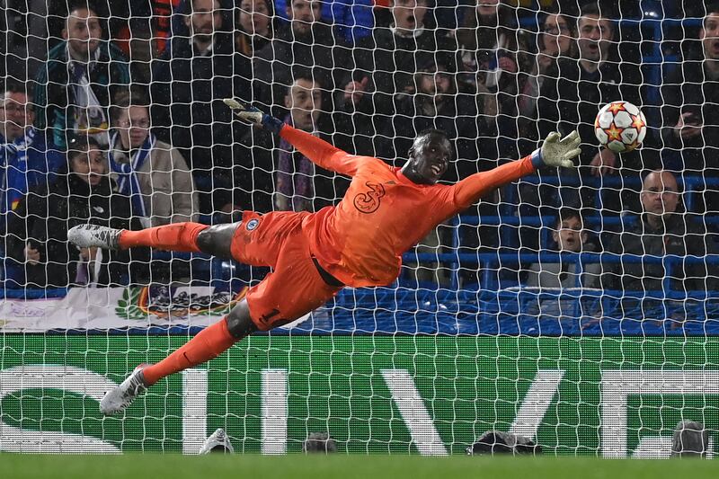 Edouard Mendy cannot stop Karim Benzema making it 2-0 to Real. AFP