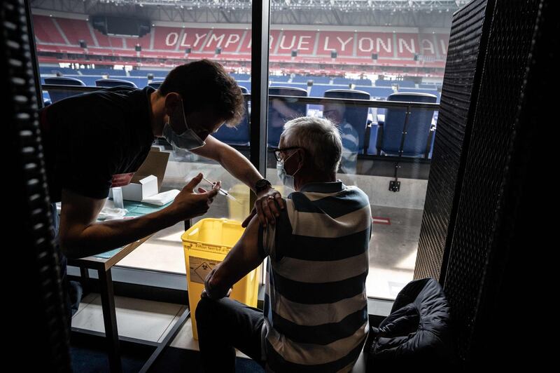 A patient receives an injection of the Moderna Covid-19 vaccine at a mass vaccination centre set up on April 3 in the OL Group's Groupama Stadium, in Decines-Charpieu. AFP
