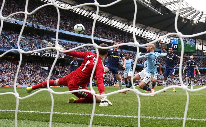 Manchester City's David Silva scores their second goal past Fulham's Marcus Bettinelli in their 34th unbeaten match in a row against promoted teams at the Etihad Stadium. Action Images via Reuters