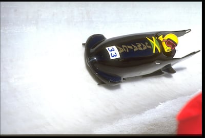 22 FEB 1988:  D STOKES (DRIVER) AND M WHITE IN ACTION FOR JAMAICA I DURING THE TWO MAN BOBSLEIGH COMPETITION AT THE 1988 WINTER OLYMPICS IN CALGARY. Getty Images