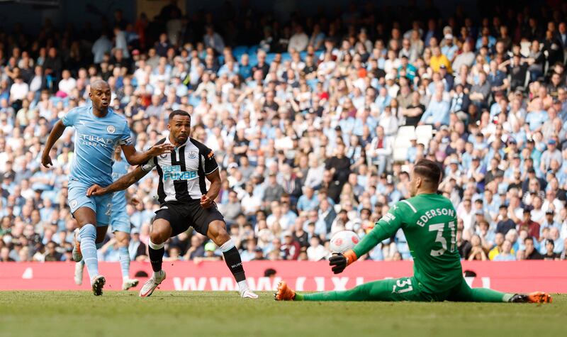 Newcastle substitute Callum Wilson sees a shot saved by City goalkeeper Ederson. Reuters