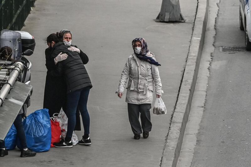 A released woman prisoner hugs her mother after alighting a bus near Bakirkoy women's prison in Istanbul. AFP