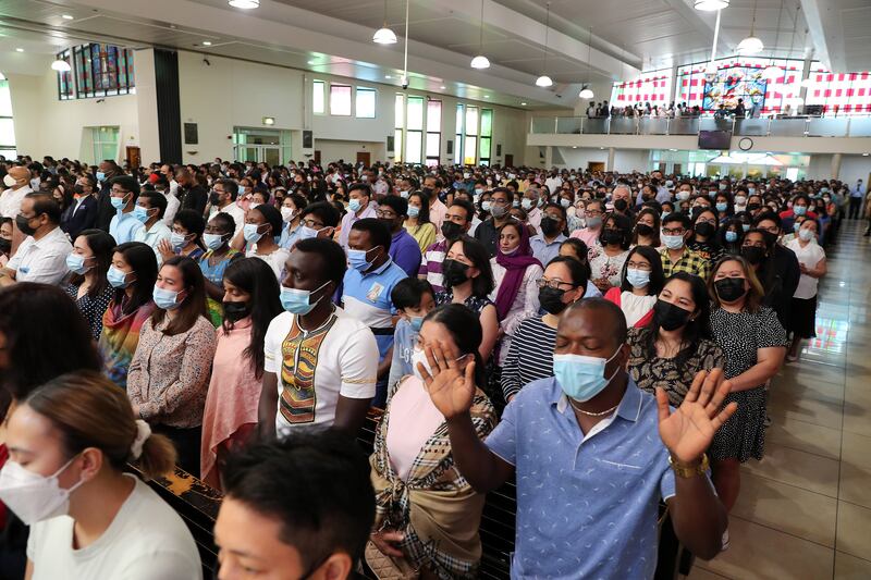 People attend Easter Sunday Mass at St Mary's Dubai. Pawan Singh / The National