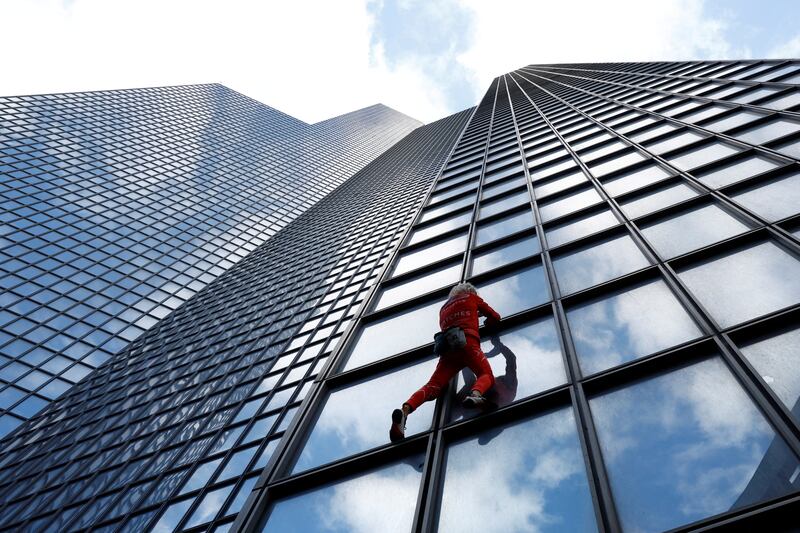 French 'Spiderman' Alain Robert during his unsuccessful attempt to climb the TotalEnergies skyscraper to highlight the fuel and energy crisis, in La Defence, near Paris. Reuters