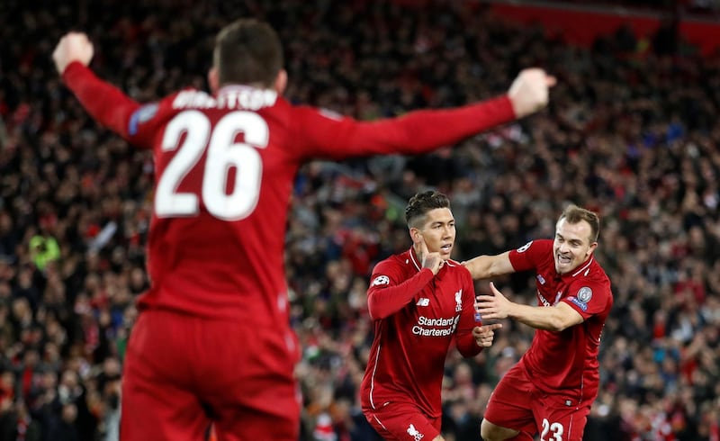 Liverpool striker Roberto Firmino, centre, celebrates opening the scoring against Red Star Belgrade at Anfield. Liverpool won the Uefa Champions League Group C match on Wednesday 4-0. Reuters