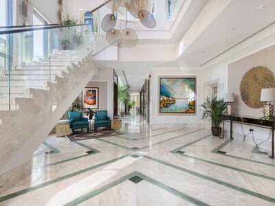 The triple-height ceiling in the entrance hall. Courtesy Luxhabitat Sotheby's International Realty