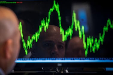 A trader watches his chart while working on the floor of the New York Stock Exchange. Photo: Reuters