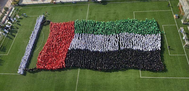 Largest human image of a national waving flag: 
More than 4,000 school­children came together last year in honour of the UAE’s 46th National Day to set this record, each one dressed in the colours of the country’s national flag. The students, from Gems Cambridge International School and Gems United Indian School from Abu Dhabi, arranged themselves to create an image of it waving.