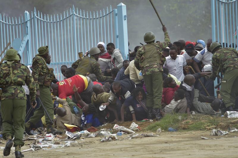 Kenyan Police intervene outside the Kasarani stadium during a stampede as supporters of Kenya's president try to get into the venue to attend his inauguration ceremony on November 28, 2017. Simon Maina / AFP