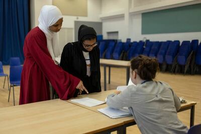 Students arrive to collect their GCSE results at the City of London Academy on August 12 in London, England. Getty Images