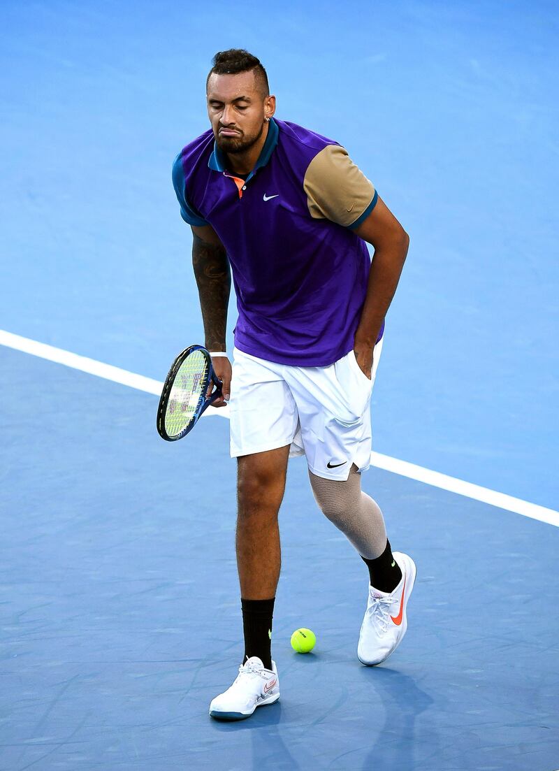 Nick Kyrgios leaves the court as he refuses to play after receiving a time violation. EPA