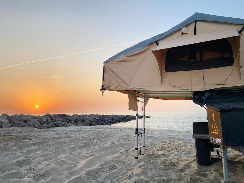 You can choose to camp on the beach or in the desert. Photo: Campr