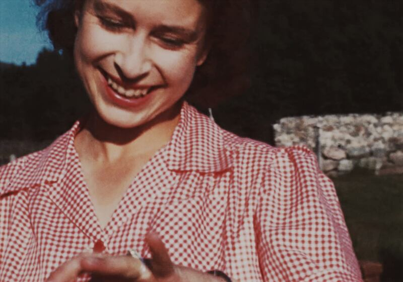 Princess Elizabeth showing off her new engagement ring soon after Prince Philip's marriage proposal at Balmoral, in 1946.