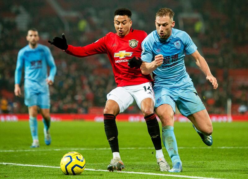 Manchester United's Jesse Lingard challenges for the ball with Burnley's Charlie Taylor. EPA