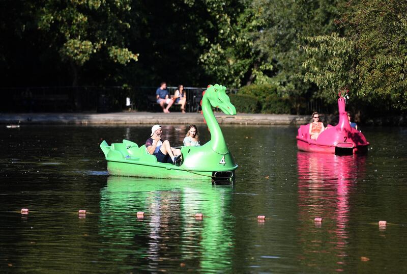 People peddle boats in the sunshine at Alexandra Palace in London, Britain. EPA