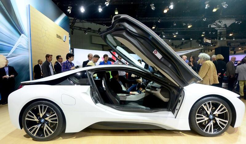 The BMW i8, due out next Summer, attracts attention while displayed at the LA Auto Show. AFP PHOTO/Frederic BROWN

