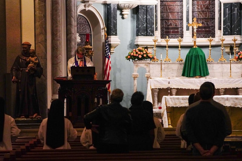 Reverend Paul Felix leads a prayer vigil held for the victims of the Astroworld crowd surge, at the Annunciation Catholic Church in Houston. AFP