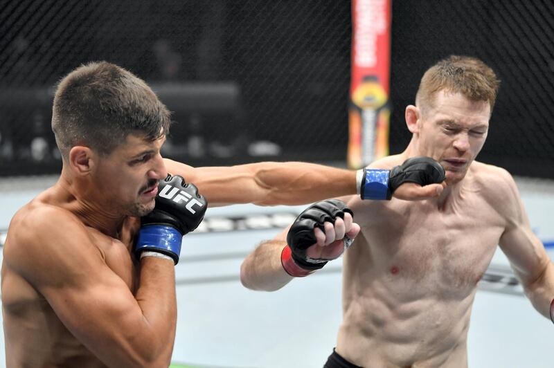 ABU DHABI, UNITED ARAB EMIRATES - JULY 19: (L-R) Joel Alvarez of Spain punches Joe Duffy of Ireland in their lightweight bout during the UFC Fight Night event inside Flash Forum on UFC Fight Island on July 19, 2020 in Yas Island, Abu Dhabi, United Arab Emirates. (Photo by Jeff Bottari/Zuffa LLC via Getty Images) *** Local Caption *** ABU DHABI, UNITED ARAB EMIRATES - JULY 19: (L-R) Joel Alvarez of Spain punches Joe Duffy of Ireland in their lightweight bout during the UFC Fight Night event inside Flash Forum on UFC Fight Island on July 19, 2020 in Yas Island, Abu Dhabi, United Arab Emirates. (Photo by Jeff Bottari/Zuffa LLC via Getty Images)