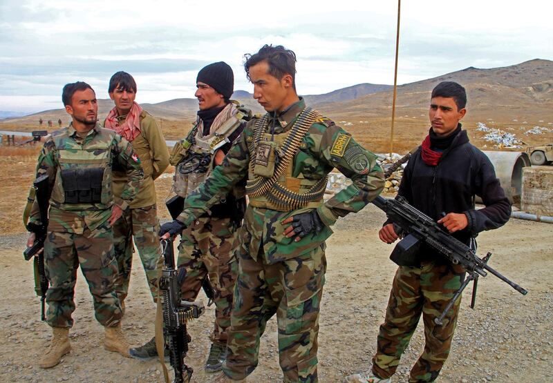 Afghan National Army soldiers keep watch outside of a military compound after a car bomb blast on the outskirts of Ghazni city, Afghanistan November 29, 2020. REUTERS/Mustafa Andaleb