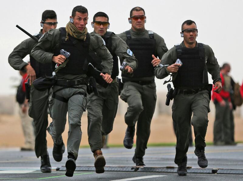 An Argentina SWAT team, Alacran, competes during the UAE SWAT Challenge, organized by the United Arab Emirates interior ministry in Dubai, UAE, Tuesday, Feb. 12, 2019. Forty-eight SWAT teams from 29 nations are competing. (AP Photo/Kamran Jebreili)