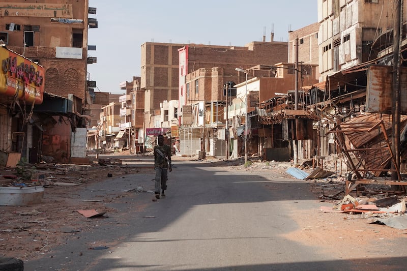 A member of the Sudanese army amid devastation in the city of Omdurman, near the capital Khartoum. Reuters
